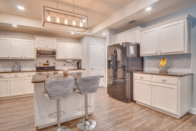 Building Photo - Milton 4BR Pool Home with Office, Vaulted Ceilings, Screened Saltwater Pool & 2-Car Garage