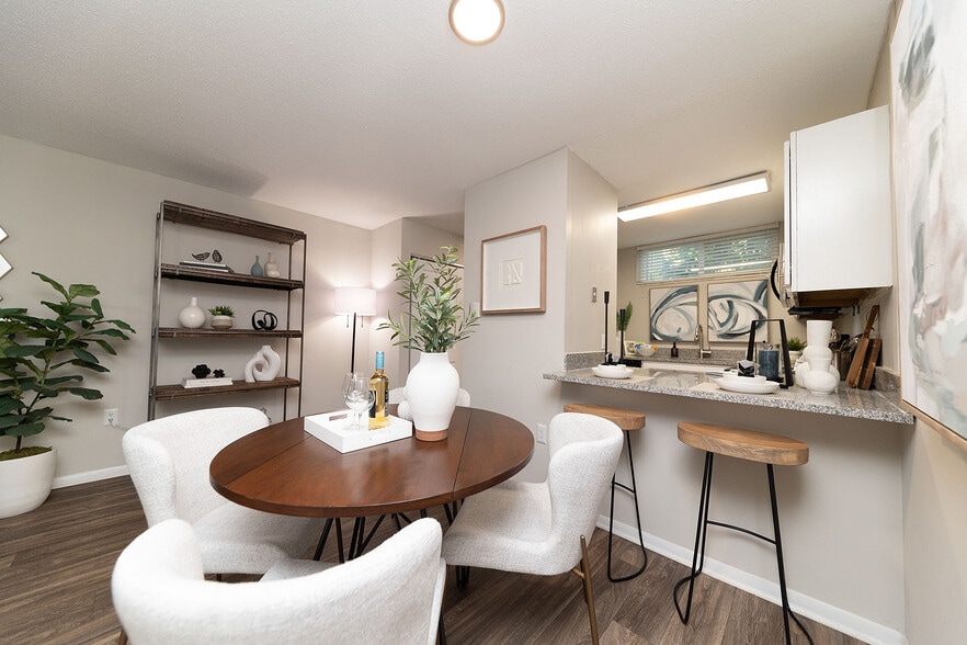 Dining area with hardwood-style flooring - Vetra West Hills