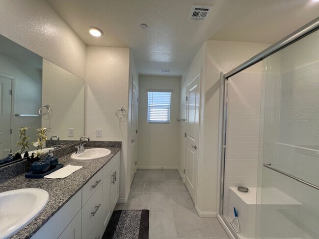 Building Photo - FULLY FURNISHED!!! beautiful 3 bedroom 2 and half bath home is located in the Symmetry Bay Cadenc...