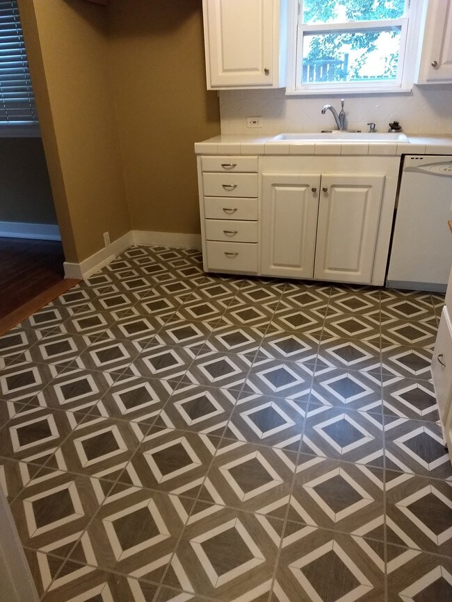 New flooring. - 13644 Earlham Dr