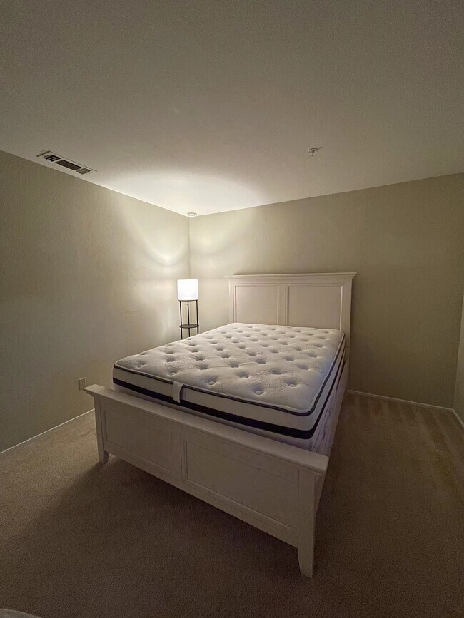 Bedroom with queen side bed and light - 480 Bollinger Canyon Ln