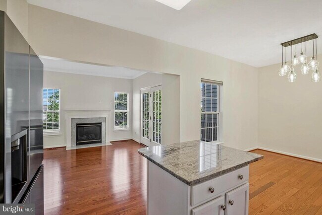 Building Photo - This beautifully maintained brick-front, three-level townhome is located in a highly sought-after...