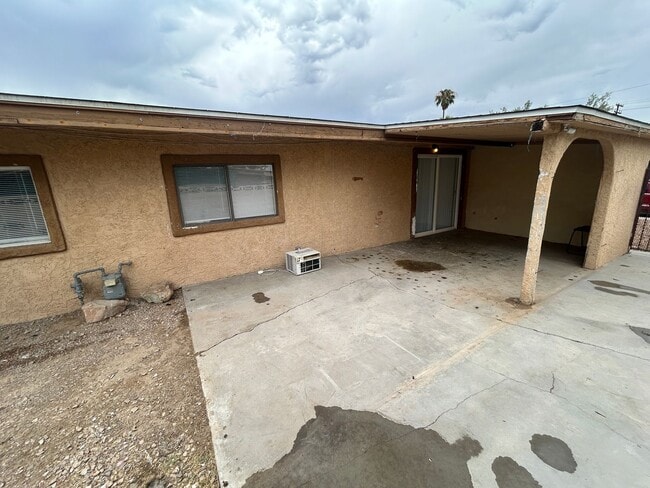 Building Photo - Single story home with large backyard and huge carport with plenty of storage.