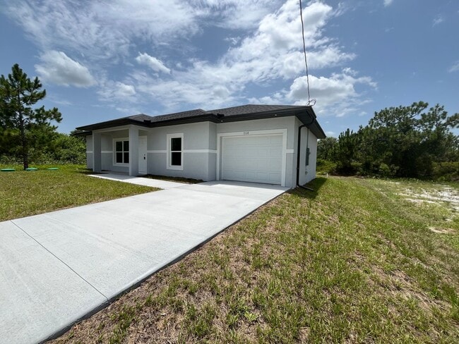 Building Photo - NEW CONSTRUCTION- Modern 3 Bed / 2 Bath Home in Lehigh Acres