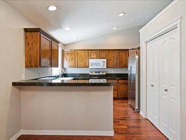Building Photo - June Rent Free!!  Move Today!  Four Bedroom, Three Bath Home with Beautiful Backyard, Two Car Gar...