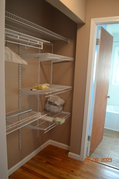 Linen storage with clothing racks - 15314 Fuller Ave
