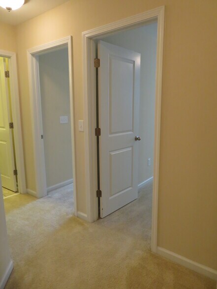 View from loft at the top of the stairs to 2nd & 3rd Bedrooms, & bath at the far left - 2496 Stadium Dr
