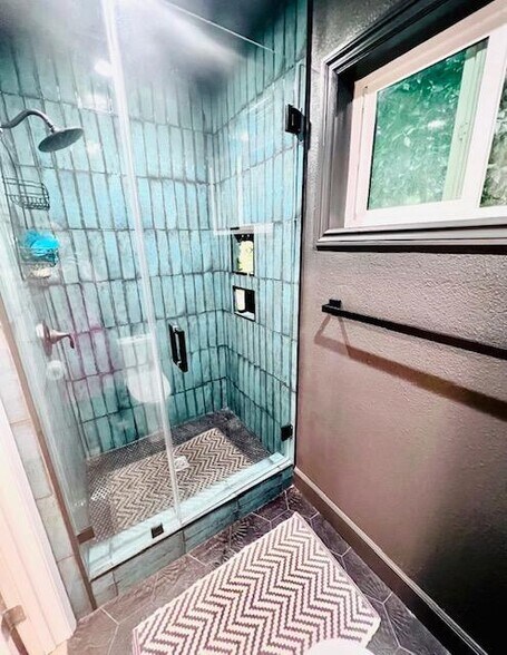 Primary Shower with penny tile - 2411 Prospect Ave