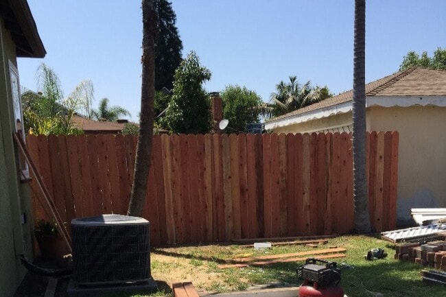 New fence being installed - 505 Lime St