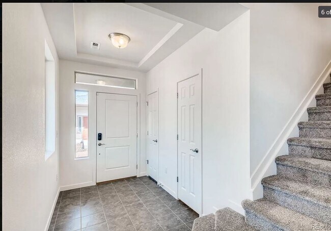 entry with closet and half bath - 17969 E 54th Ave