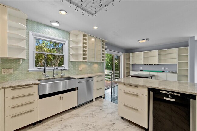 Building Photo - "Spacious 5-Bed Home with Granite Accents ...