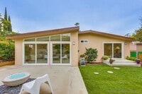 Building Photo - Beautiful 5BD/2BA on Baja!! Great backyard space with turf & fire pit!!