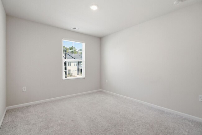 Building Photo - Upgraded 3BR Townhome in Wake Forest | Open Layout, Garage & Resort-Style Amenities