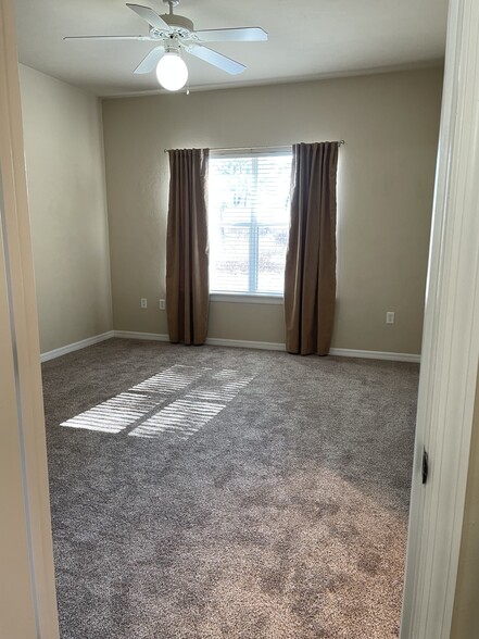 Southern facing double windows from bedrom, fits king bed, dresser, & desk. - 13200 W Newberry Rd