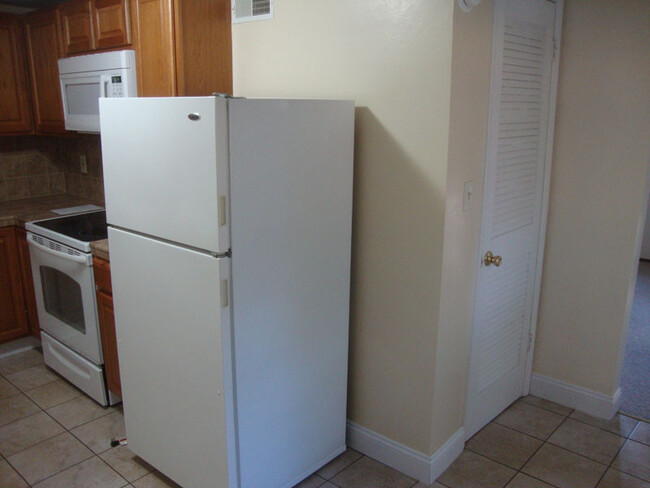 Utility room on right, kitchen to the left. - 712 Charlotte Ave