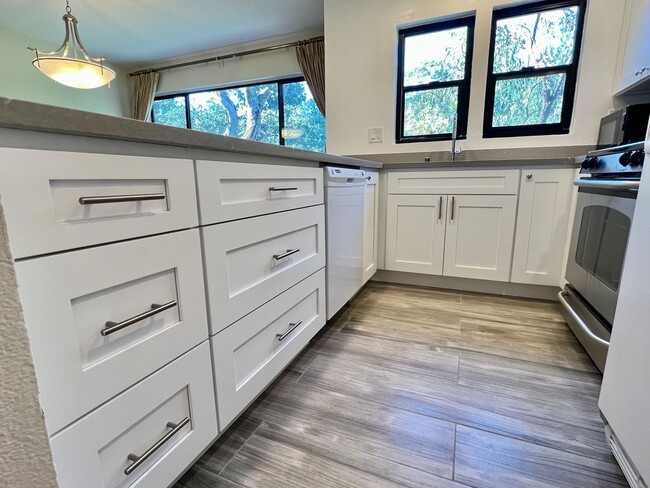 Building Photo - Great Natural light, Treetop Views with 2 Primary Suites plus OFFICE and a 2 car garage, It is li...