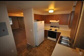 Building Photo - "Charming 2-Bedroom Retreat with Modern Co...
