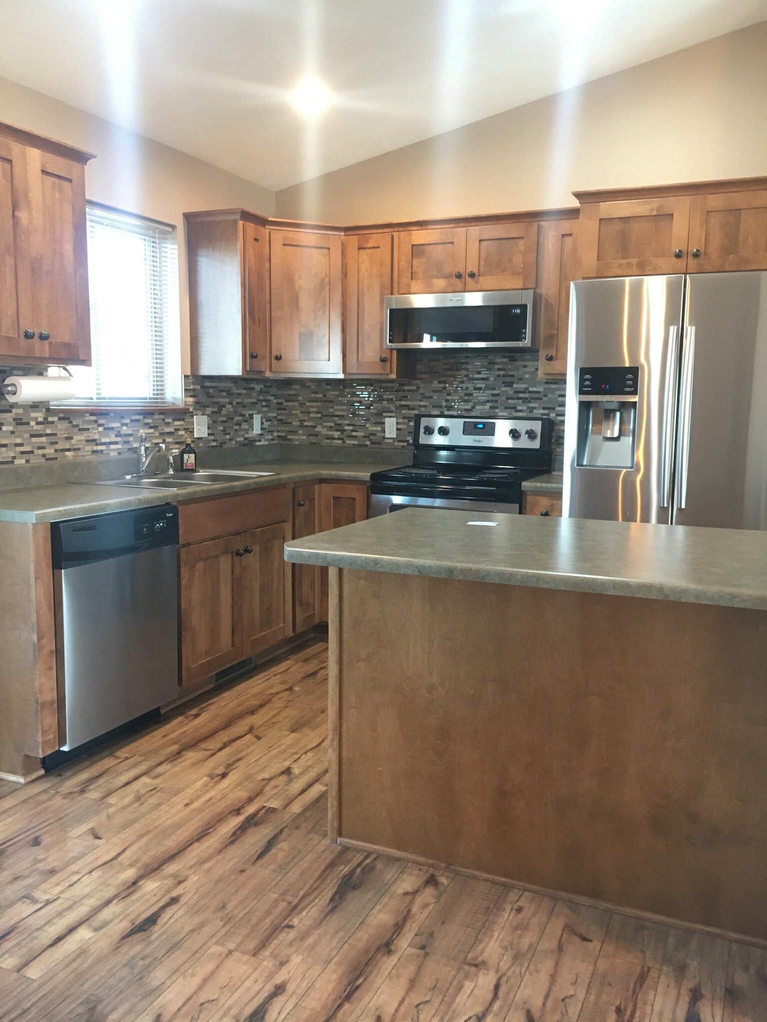 Beautiful wood flooring in the kitchen & dining room. - 4421 S Tribbey Trl