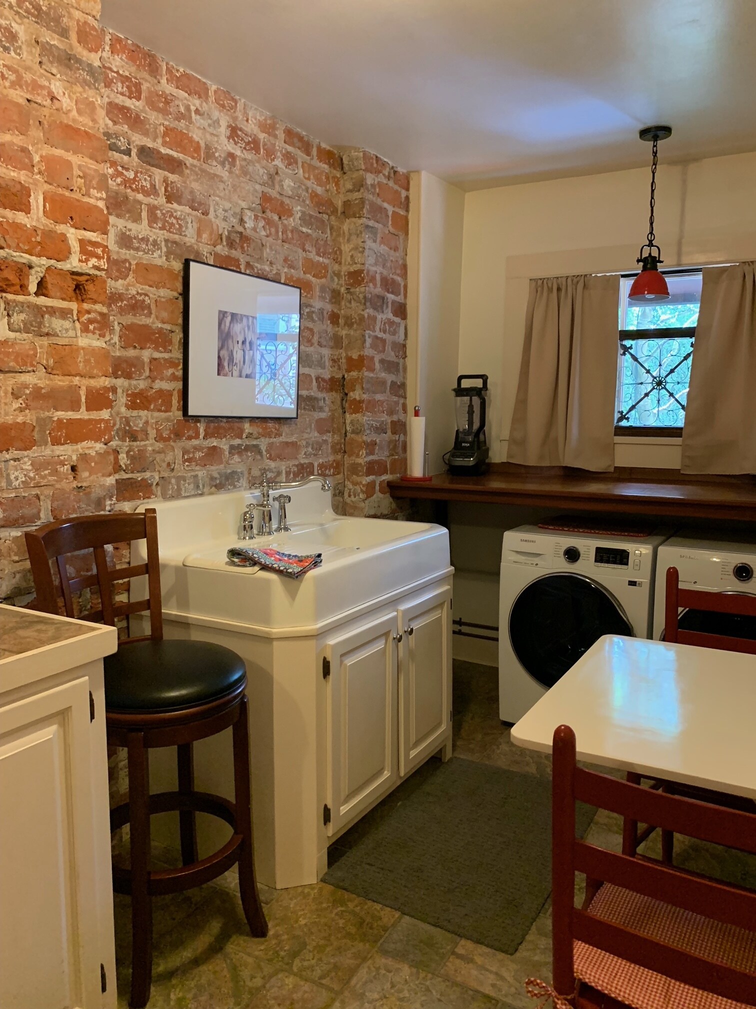 Kitchen with new front loading laundry - 4036 Saint Charles Ave