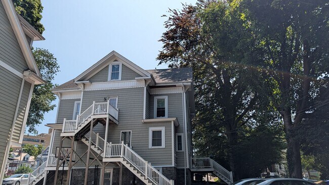 Building Photo - Spacious Townhouse: 4-bed, 3.5 bath unit in Brighton with Garage Parking