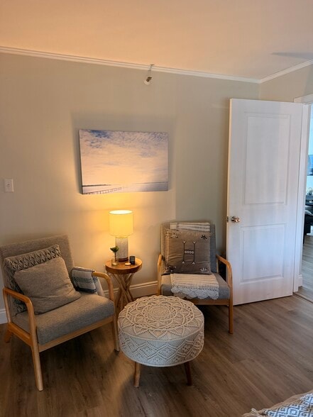 Seating area in primary bedroom - 324 E Beach Dr