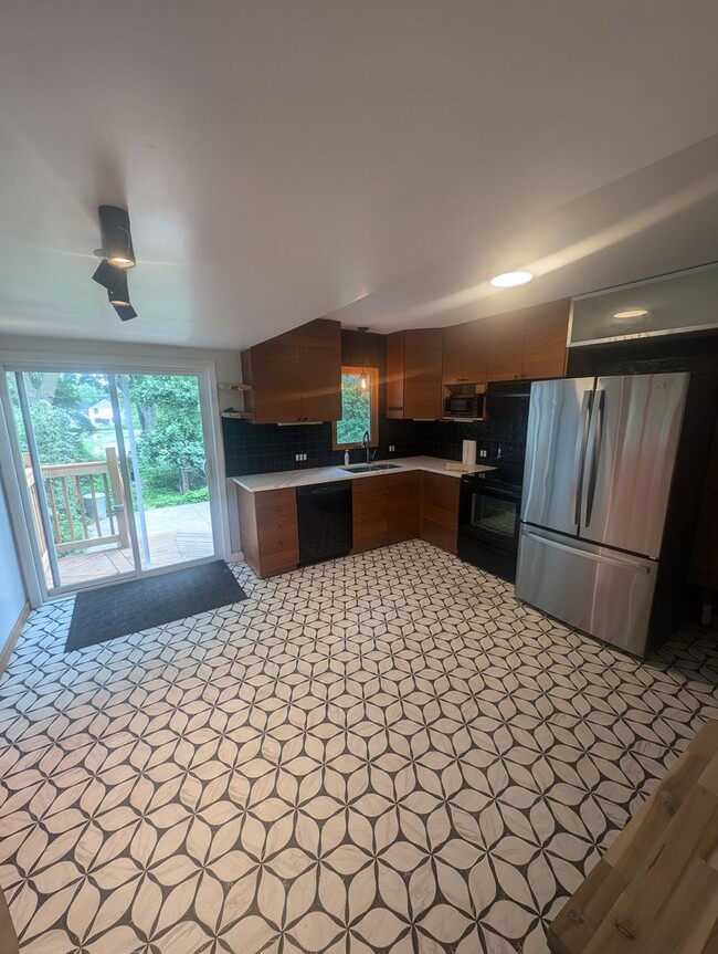 Building Photo - Charming Garden Oasis in West St. Paul – Fire Pit, Pond & Prime Location!