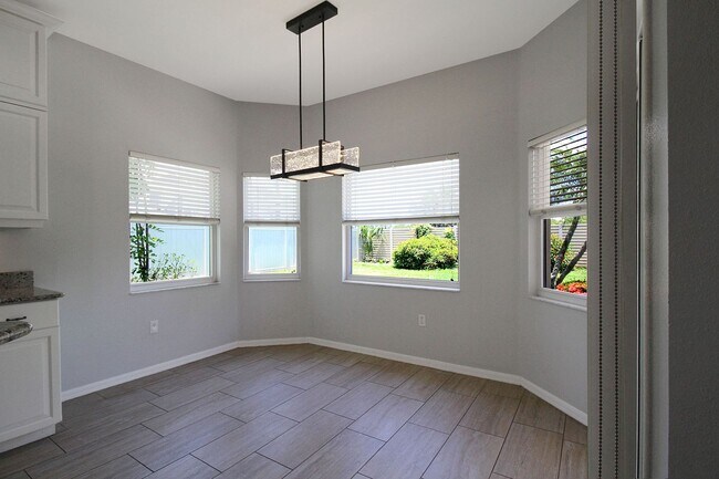 Building Photo - Annual rental: Spacious 3BR/2BA Creekwood Home with Office, Screened Lanai, EV Charger & Resort-S...