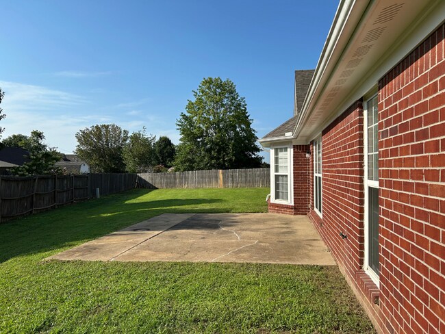 Building Photo - Spacious 4BR/2BA Olive Branch Home | 1,965 Sq Ft, Modern Fireplace, Bay Window & 2-Car Garage