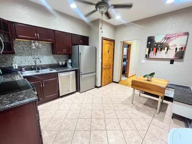 Anothe view of the kitchen with the hallway in view - 3517 19th Ave S