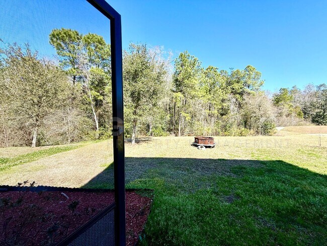 Building Photo - Room to Live, Space to Thrive! Stunning 6BR Home with Solar, Upgrades & Screened Lanai in Macclen...