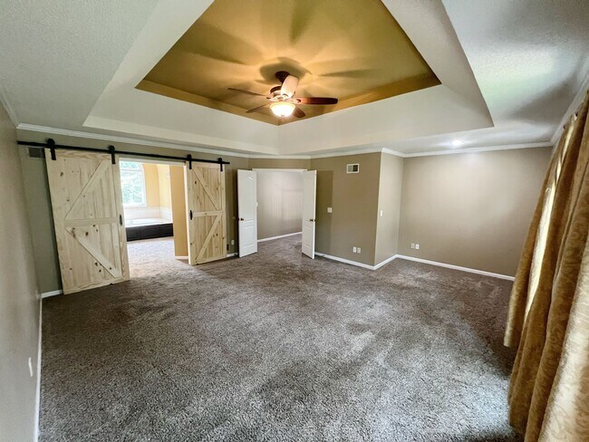 Building Photo - SEE IT NOW: Spacious 4-Bed Home with Finis...