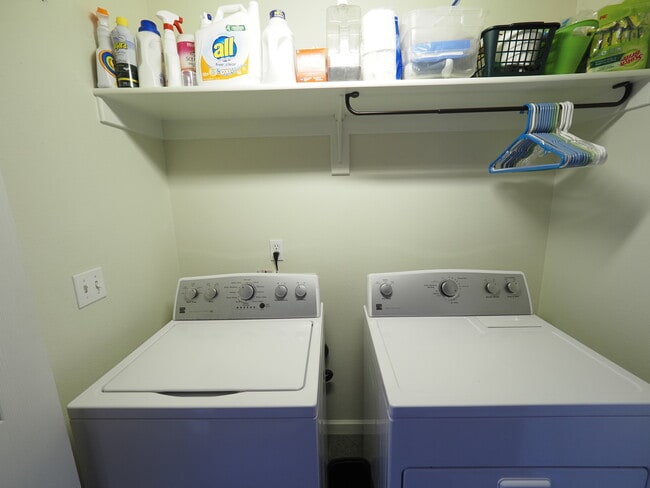 Washer and dryer in hall closet at top of stairs. - 2408 Main St