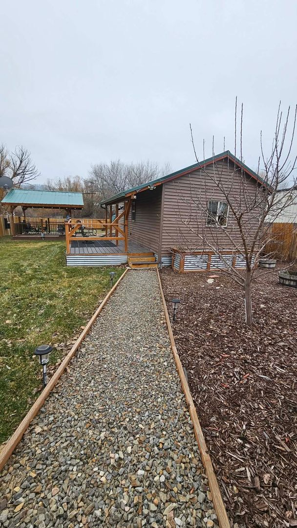 Building Photo - Fully Furnished Studio with Fenced Yard