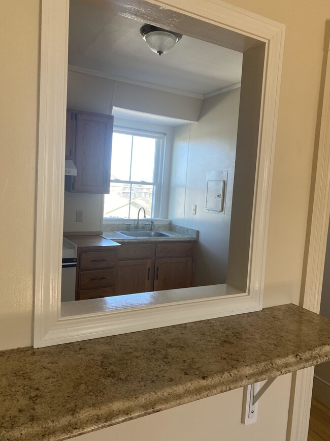 View of kitchen from large living room - 4 Arlington Rd