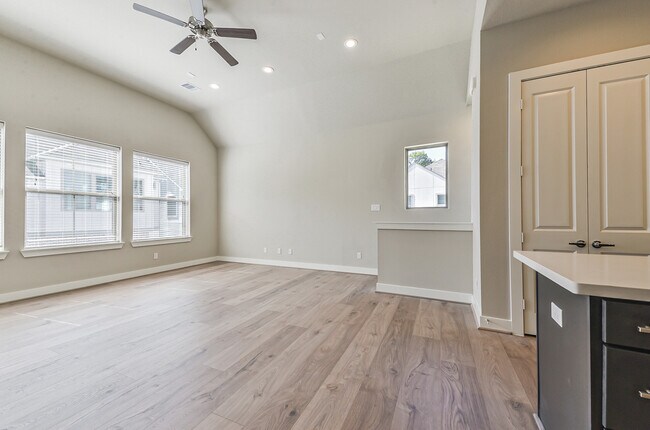 There are endless possibilities for entertaining in the huge, abundantly lighted family room. - 1108 Olivier Ln