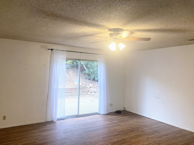 Living room with view to patio in backyard - 170 Westelle Dr