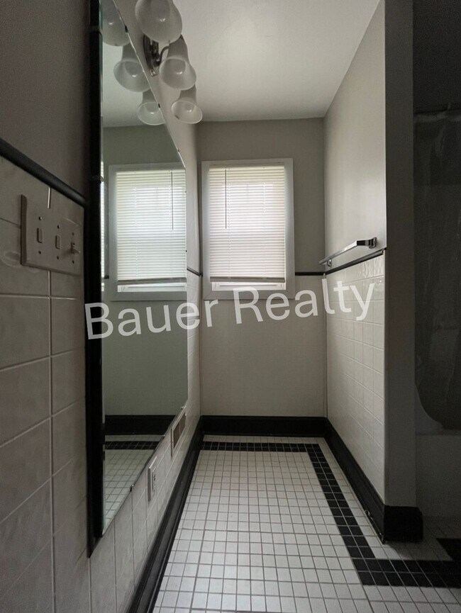 Building Photo - Three bedrooms, one and a half baths