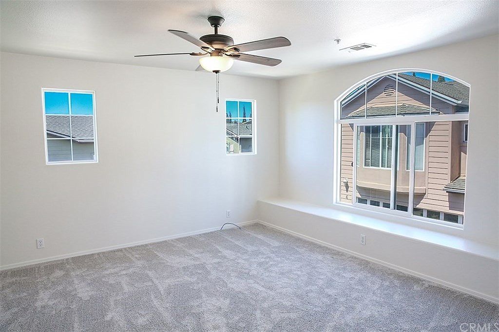 Spacious, bright primary bedroom 14' x 16' with plenty of room to share and new ceiling fan - 3051 Augusta St