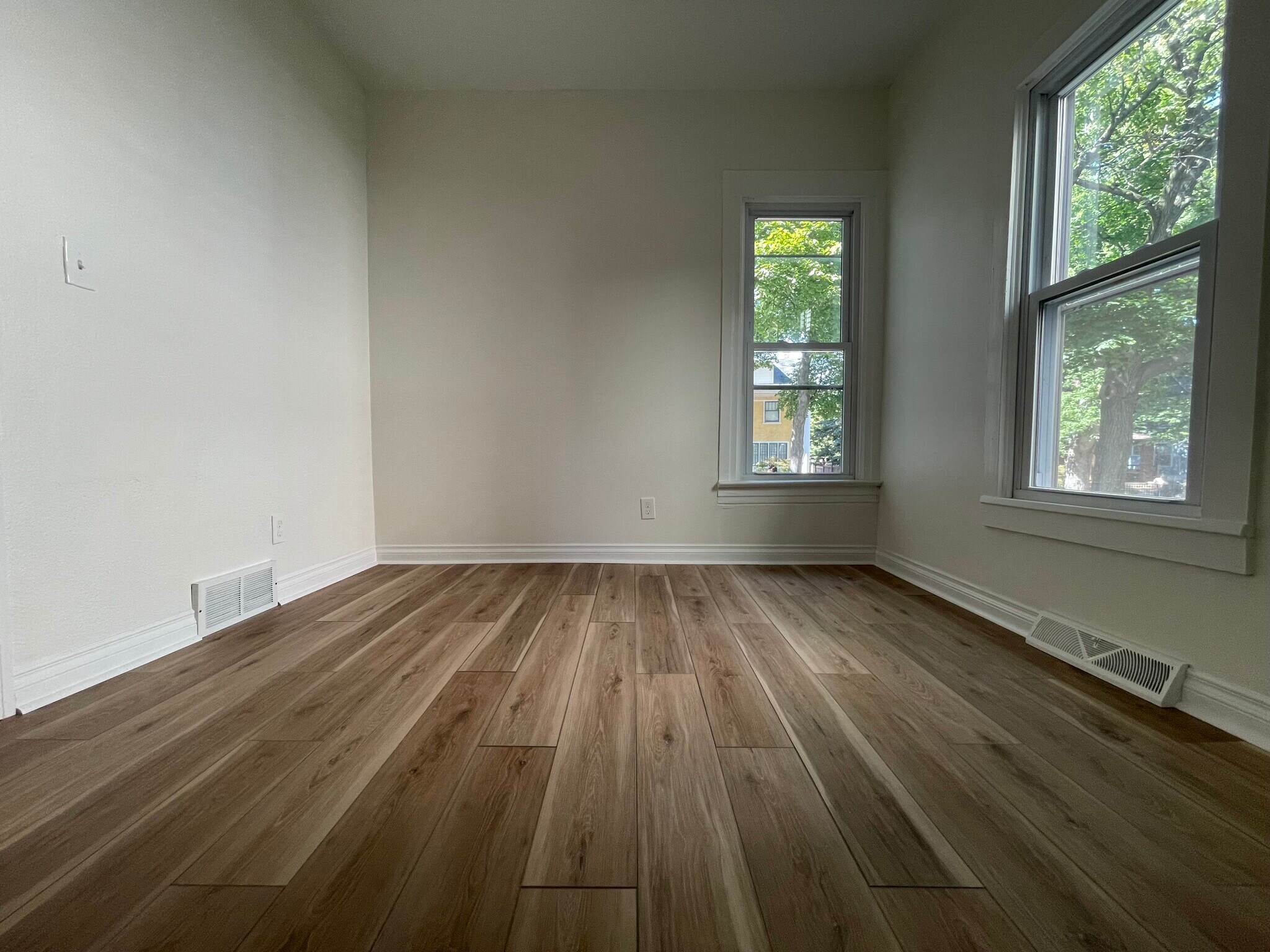 Second bedroom with multiple windows looking down State Street - 1219 State St