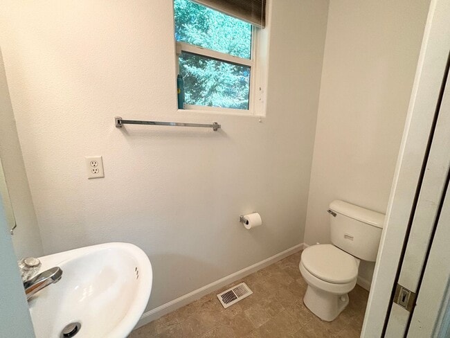 Building Photo - Stunning Remodeled Home with Office, A/C, Fenced Yard & Flexible Living Space!