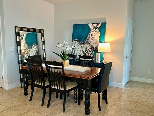 Building Photo - Open concept home offering four bedrooms, three baths, a two car garage and open lanai.
