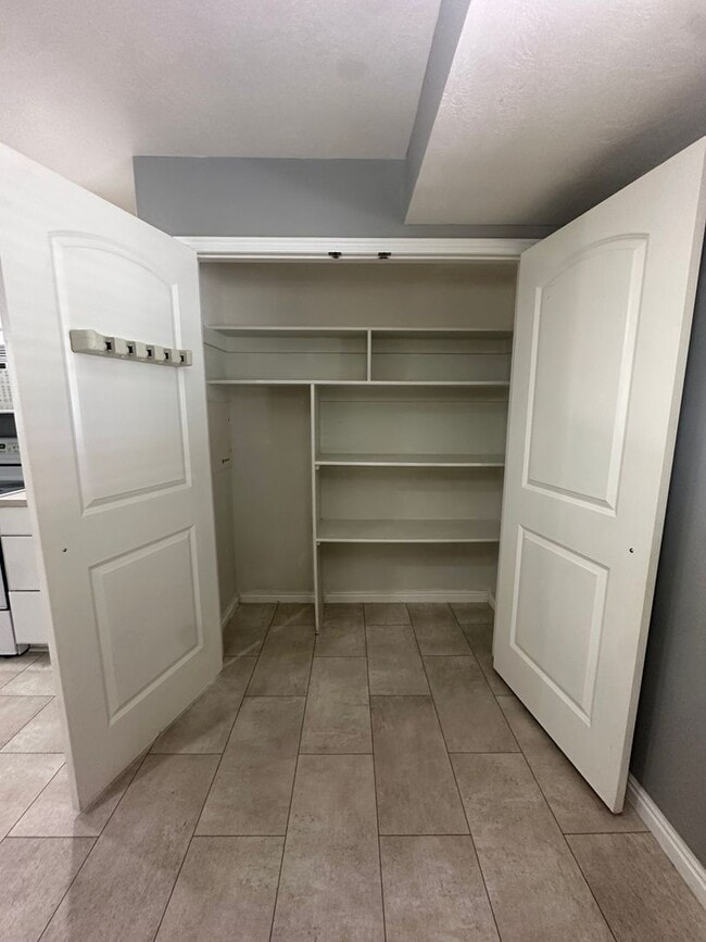 Building Photo - 2-Bedroom Townhome with Central AC and Covered Parking