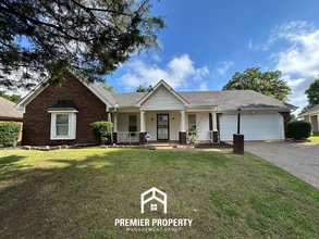 Building Photo - Beautiful 4BR/2BA Near Southwind | 1,853 Sq Ft, Dual Dining Areas, Fireplace & Garage