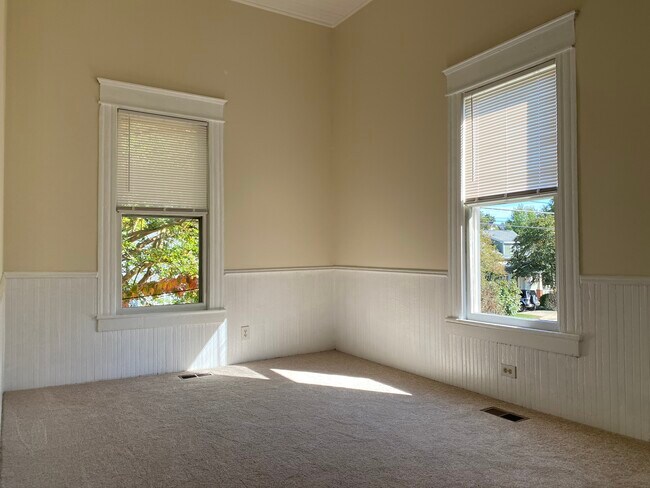 The bedroom, with a small walk-in closet, catches the morning sun. - 218 Linden Ave