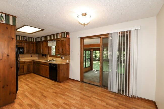 Building Photo - Two Bedroom, 2 Bath, 1-Car Garage, 1179 sq ft feet home with wood burning fireplace. and screened...