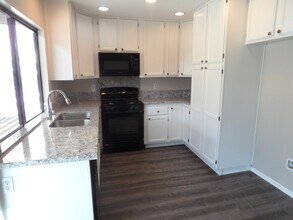 Building Photo - Two Story 4 BR 2.5 BA Condo With 2 Car Garage