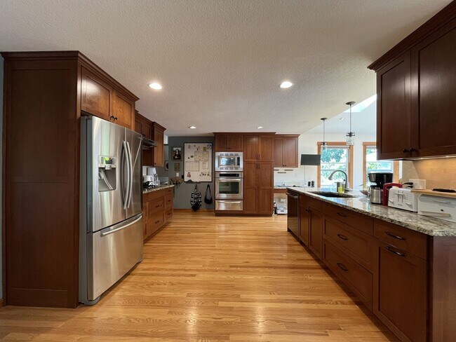 Building Photo - Bright and Open 4 Bedroom Cedar Mill Home with Vaulted Ceilings, Skylights & Multiple Living Areas