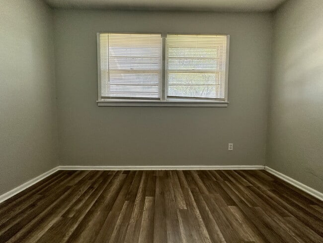 Building Photo - Updated Home with Gorgeous Floors & Large Backyard