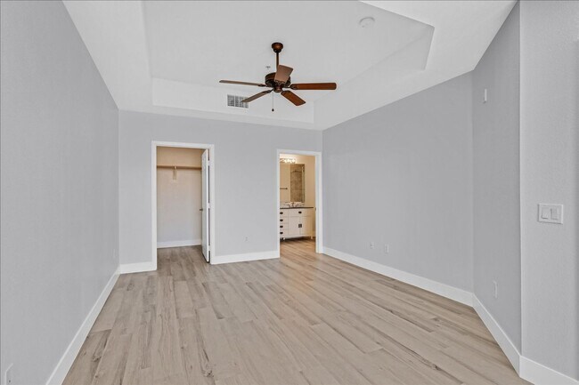 Building Photo - Top level 2 bedroom condo located in guard...