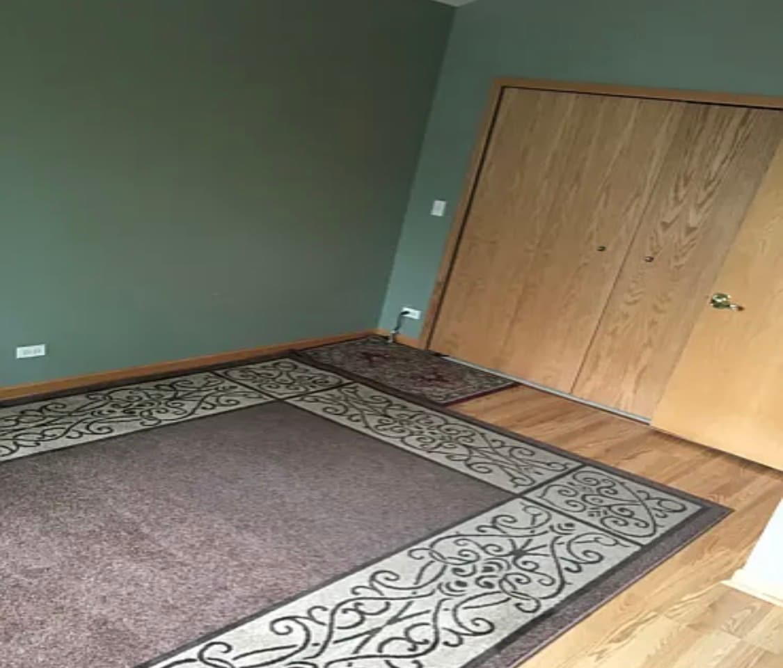 Large primary bathroom with closet and large windows - 419 W Root St